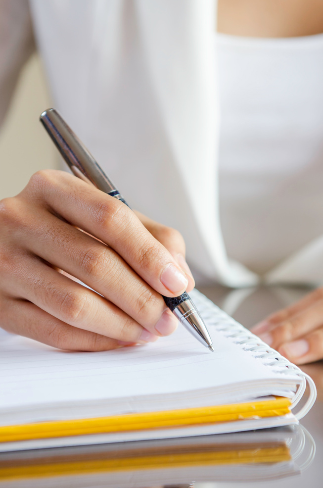 woman taking note